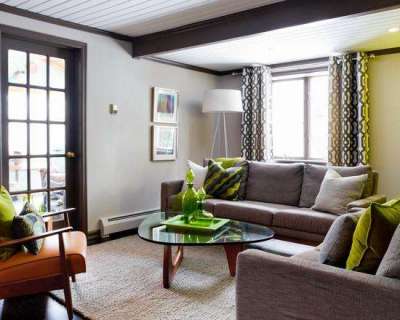 Сочетание серого и зелёного цветов в интерьере гостиной
