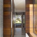 exterior-the-entrance-hall-with-wooden-wall-design-equipped-with-two-glass-walls-of-gray-wood-and-glass-entrance-and-garden-beautiful-hallway-design-ideas